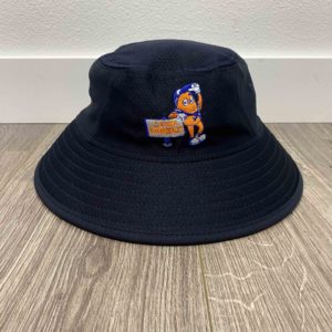 A black bucket hat with an embroidered cartoon character holding a "cool bucket" sign, placed on a wooden floor against a white wall.